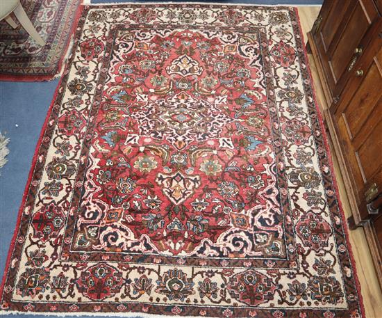 A North West Persian red ground rug 200 x 150cm